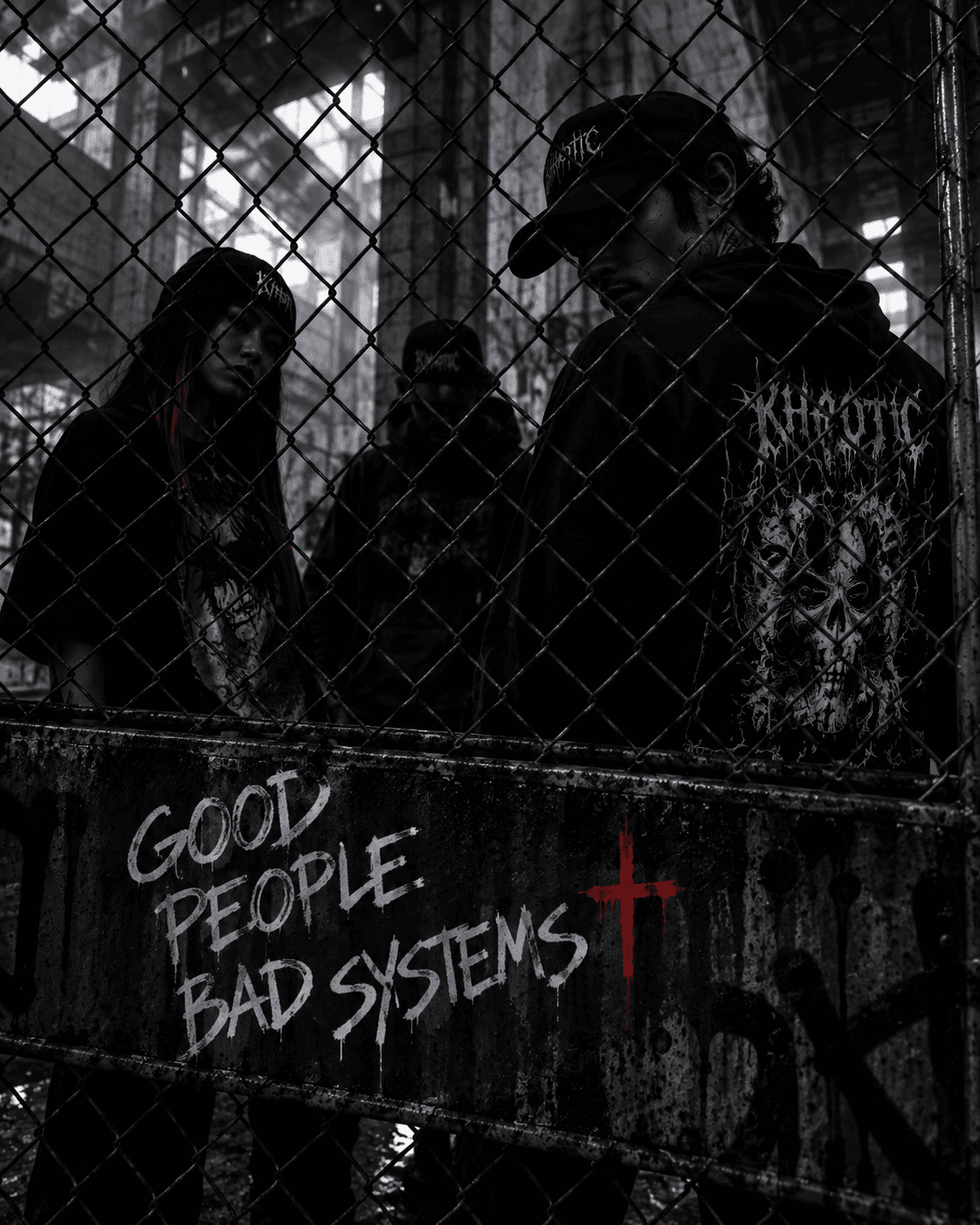 Good people, bad systems artwork beside a fence